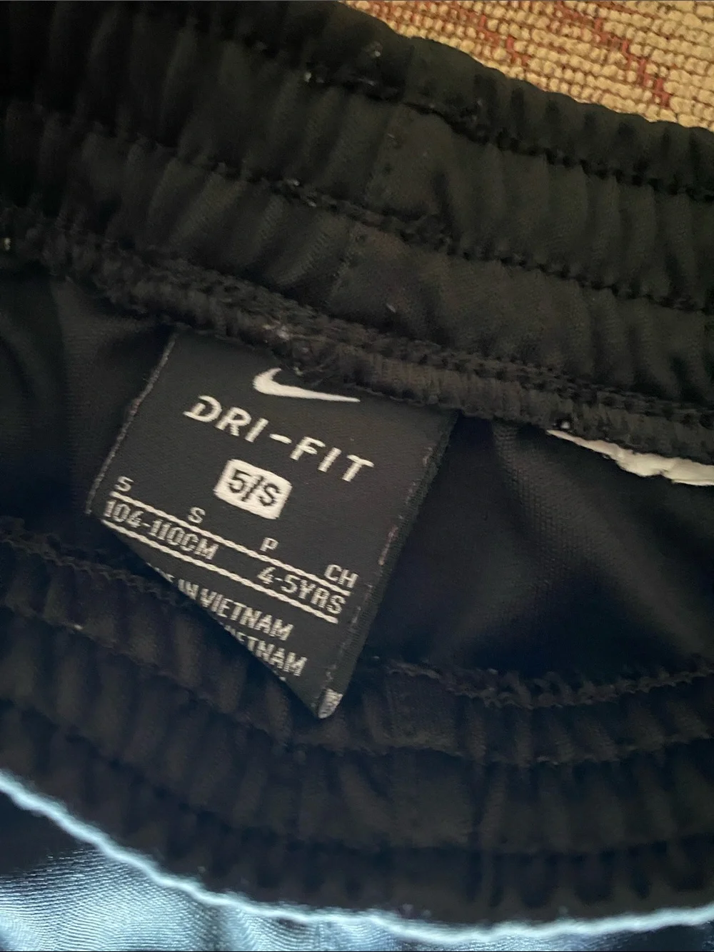 Nike Black Athletic Shorts with White Logo and Blue Swoosh